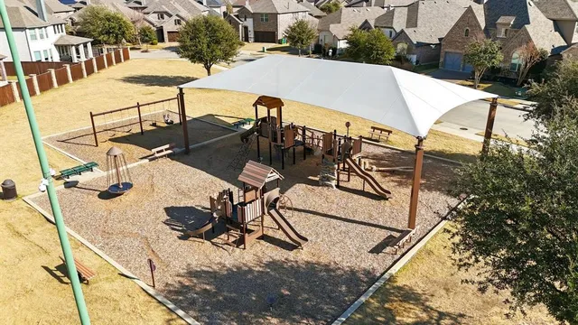 a view of a patio with chairs and table on the terrace