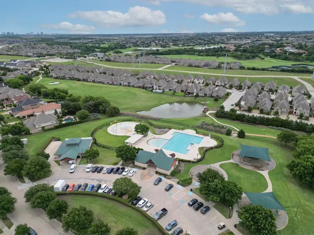 an aerial view of a house with outdoor space