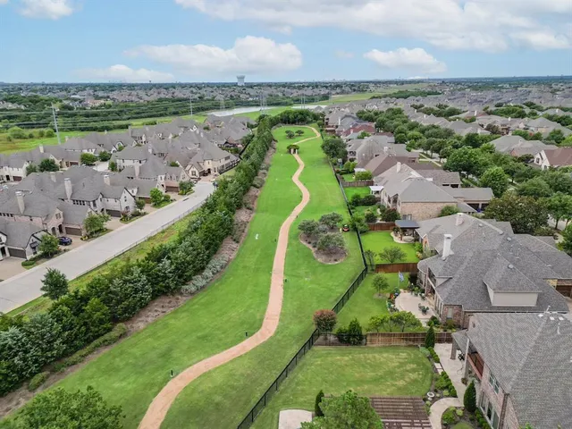 an aerial view of a houses with a outdoor space