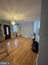 a kitchen with kitchen island granite countertop a stove and a refrigerator
