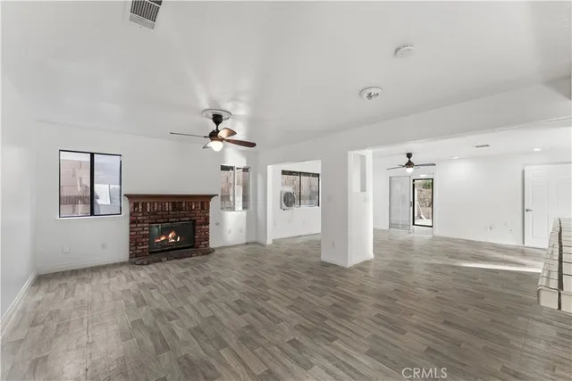 a living room with furniture and a painting on the wall