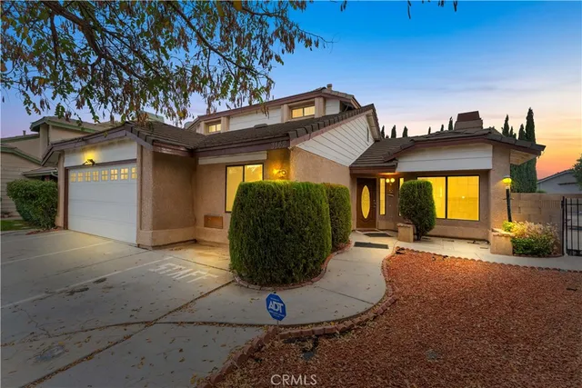a view of an entryway with wooden floor and door