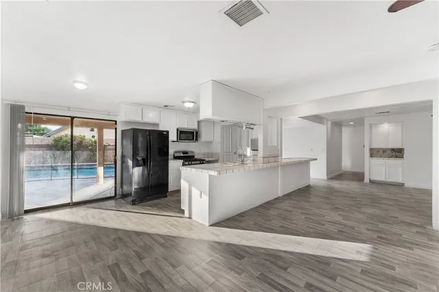 a bedroom with a large bed and a couch