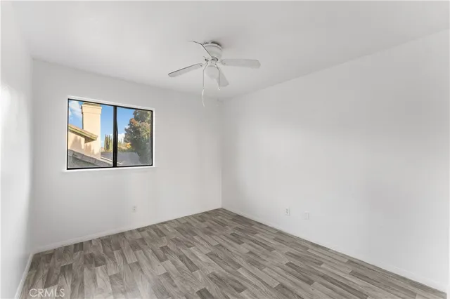 a balcony with view of tall buildings