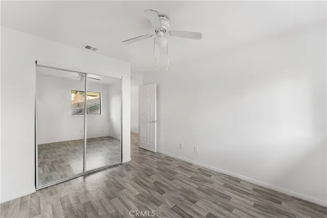 a view of a house with a swimming pool and sitting area