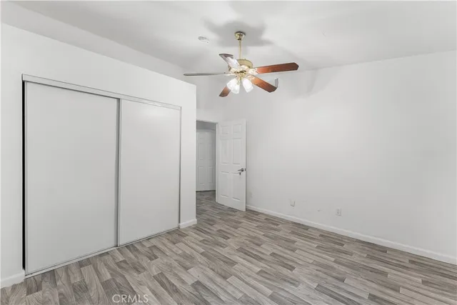 an aerial view of a house with a yard and potted plants