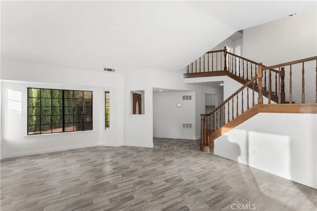 a living room with fireplace furniture and a flat screen tv