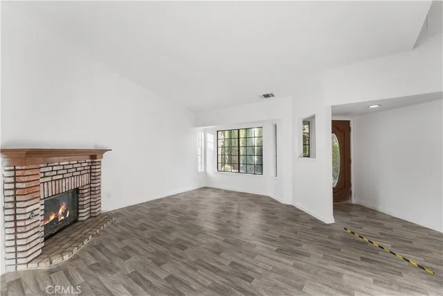 a view of a dining room with furniture and window