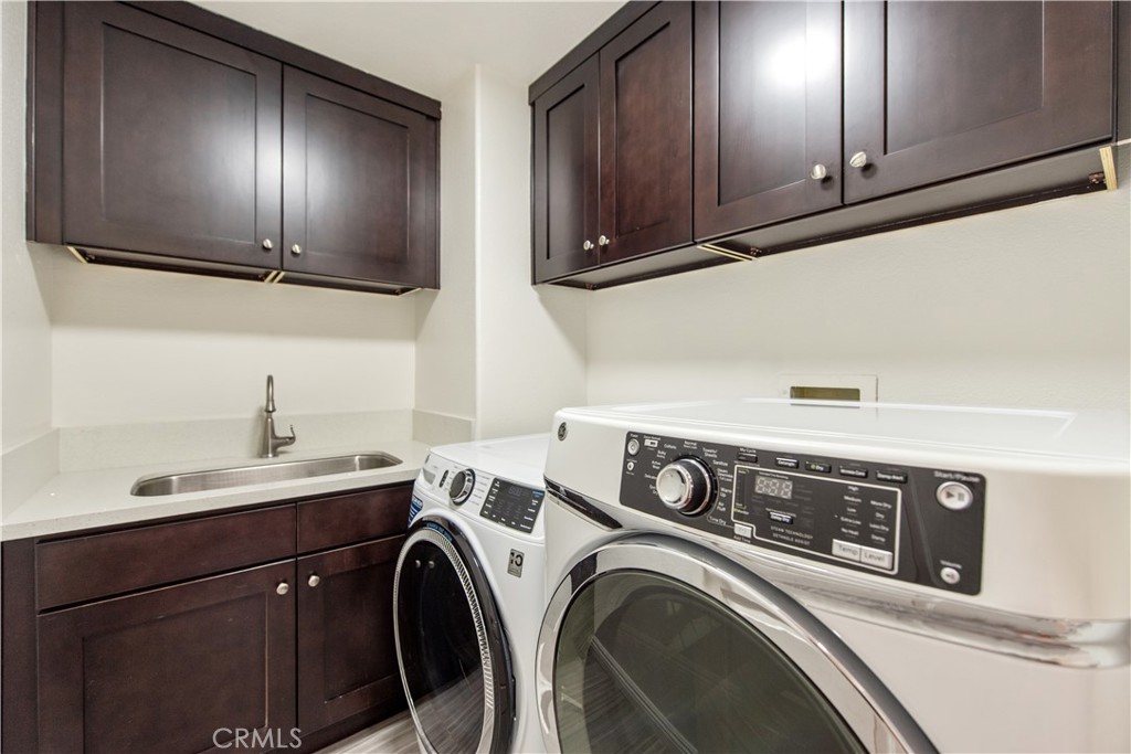 19933 Hidden Springs Road Walnut, CA 91789 - Photo 13 of 26 a utility room with dryer and washer