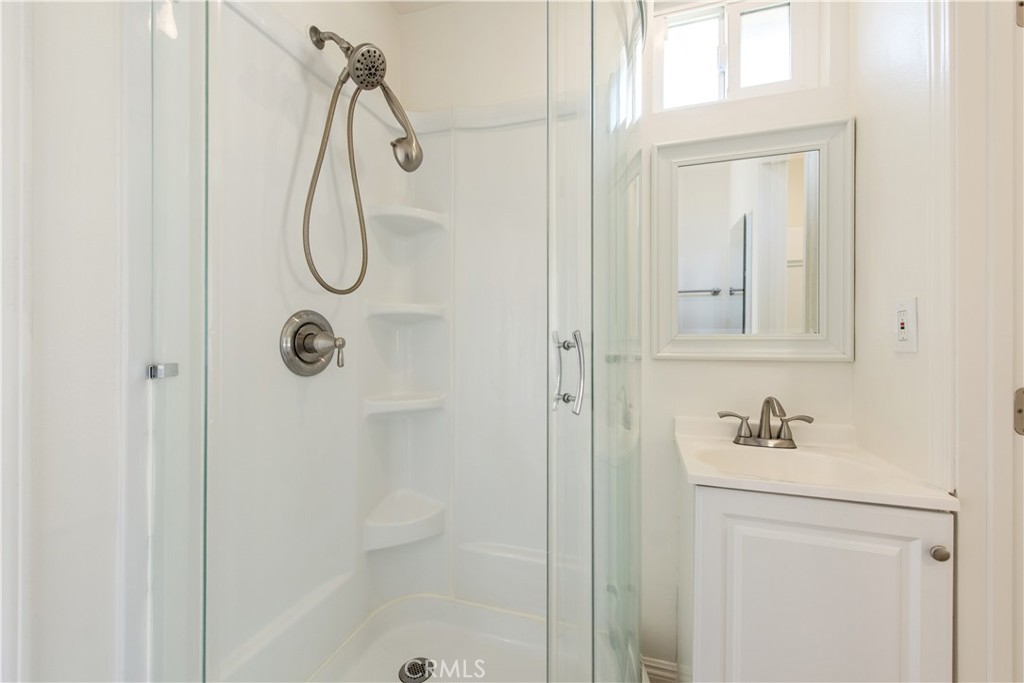 19933 Hidden Springs Road Walnut, CA 91789 - Photo 22 of 26 a bathroom with a shower a sink and a mirror