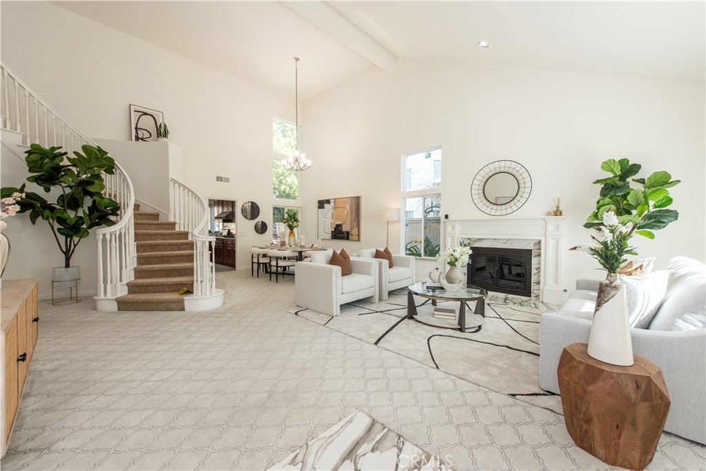19933 Hidden Springs Road Walnut, CA 91789 - Photo 3 of 26 a living room with furniture a fireplace and a chandelier
