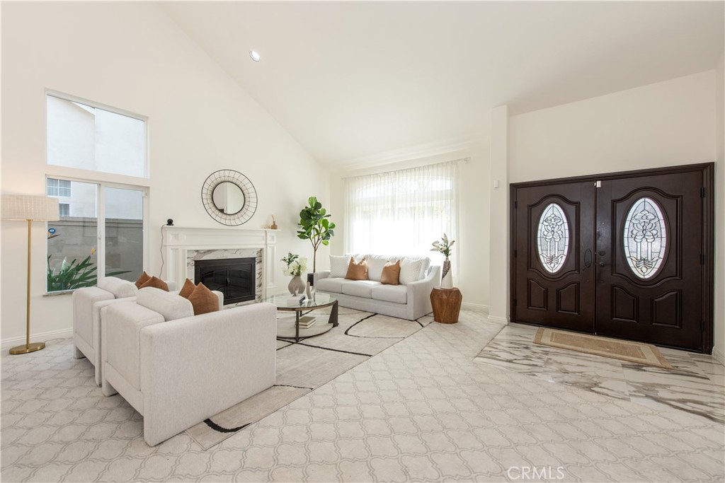 19933 Hidden Springs Road Walnut, CA 91789 - Photo 4 of 26 a living room with furniture a fireplace and a large window