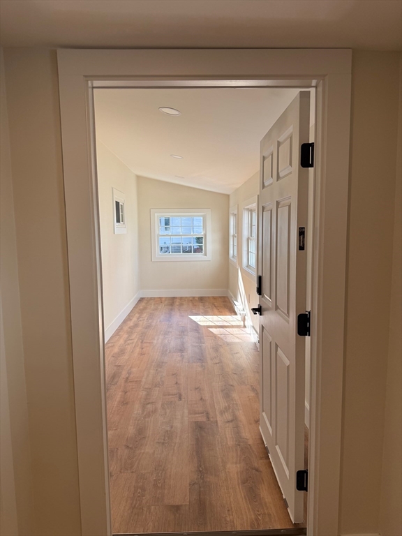 244 Main Street, Unit 1 North Andover, MA 01845 - Photo 2 of 13 a view of a hallway with wooden floor and entryway