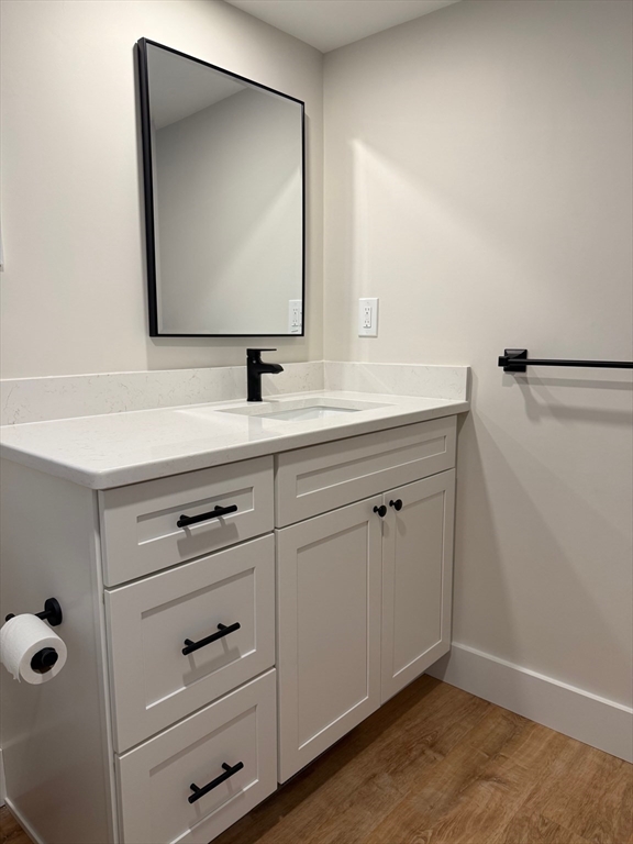 244 Main Street, Unit 1 North Andover, MA 01845 - Photo 4 of 13 a bathroom with a sink and mirror
