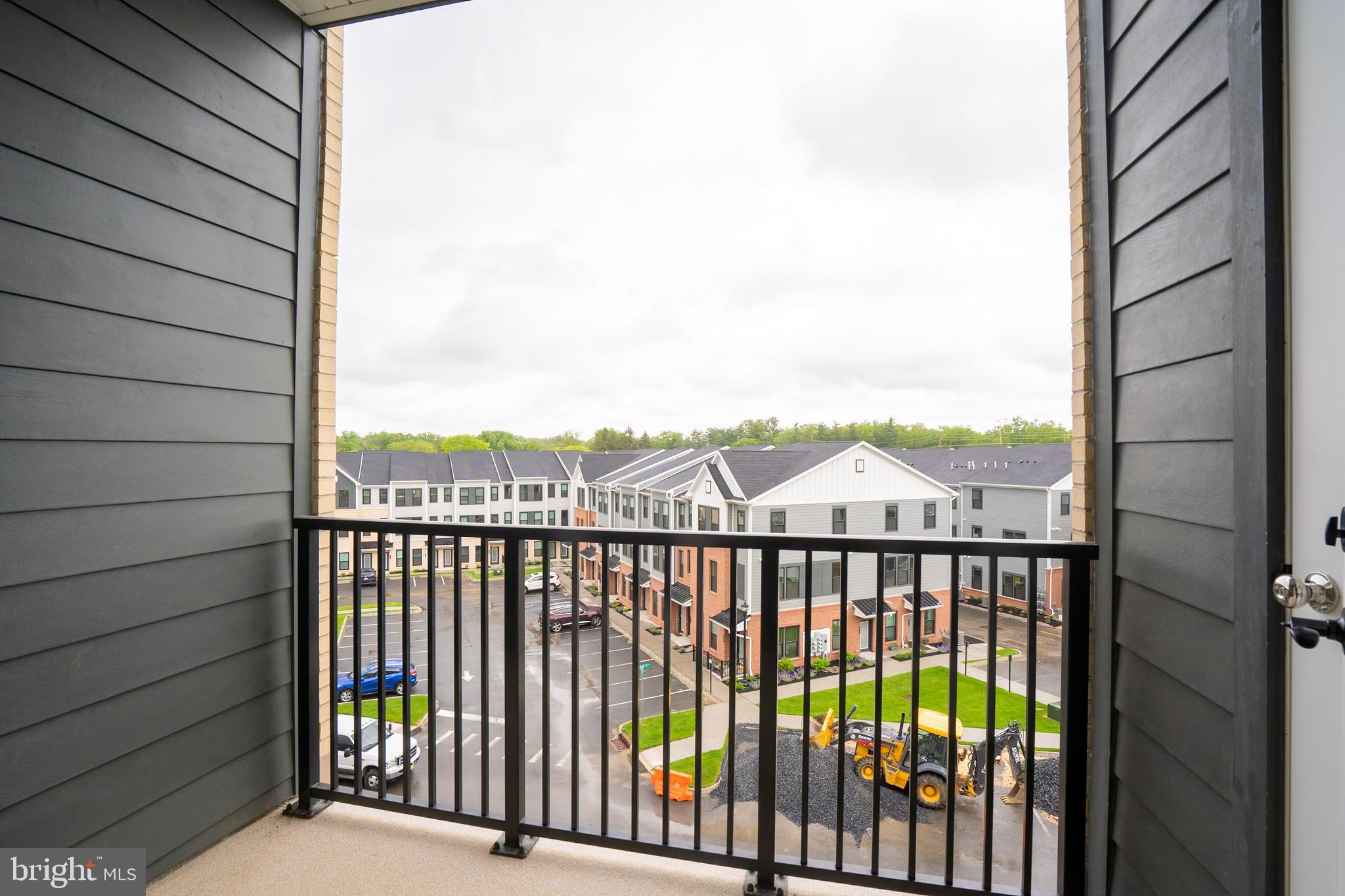 1 Culvert Drive, Unit 312 Princeton Junction, NJ 08540 - Photo 12 of 58 a view of a balcony with a floor to ceiling window