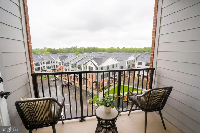 a view of a balcony with furniture