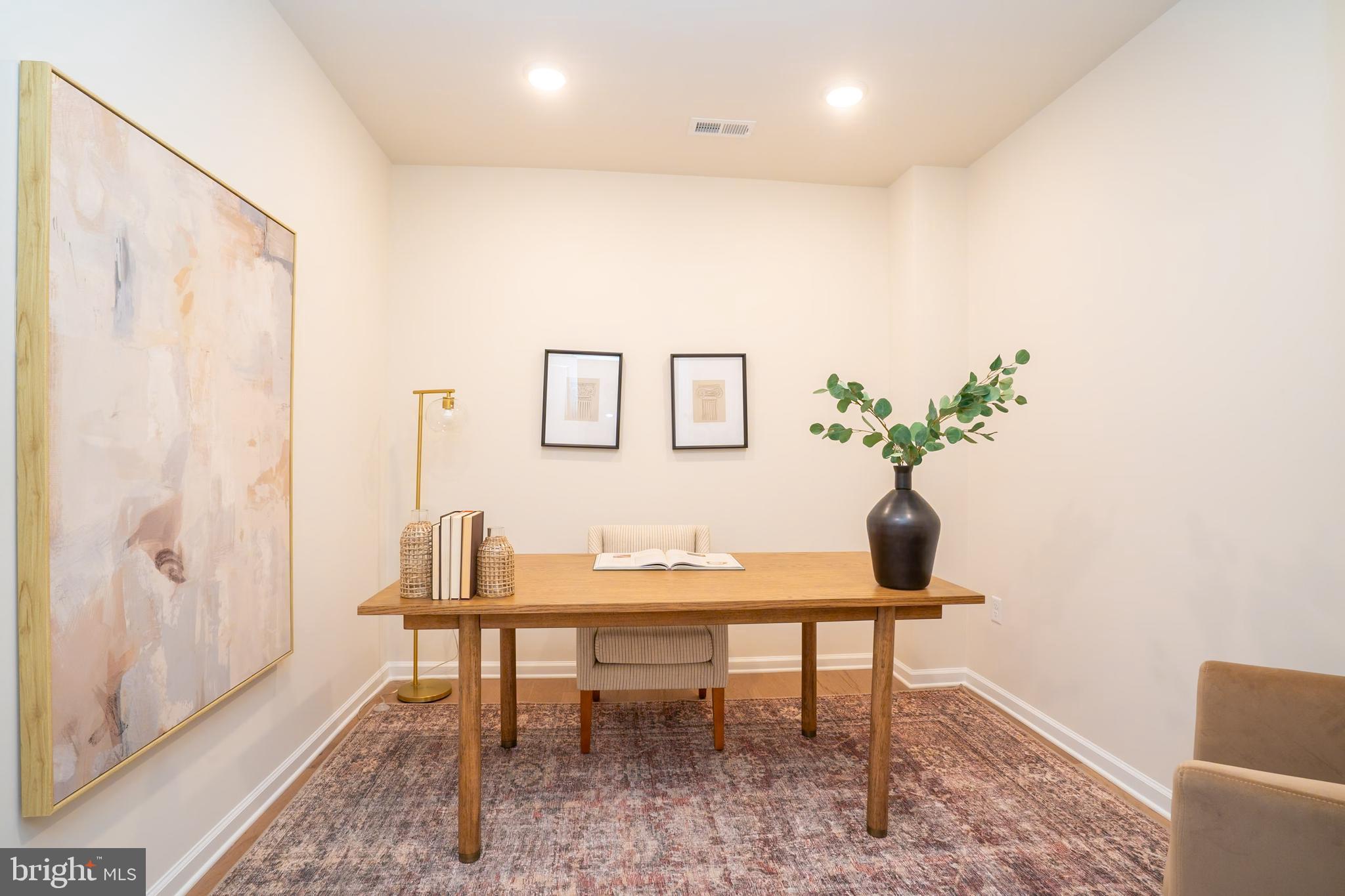 1 Culvert Drive, Unit 312 Princeton Junction, NJ 08540 - Photo 18 of 58 a living room with furniture and a potted plant