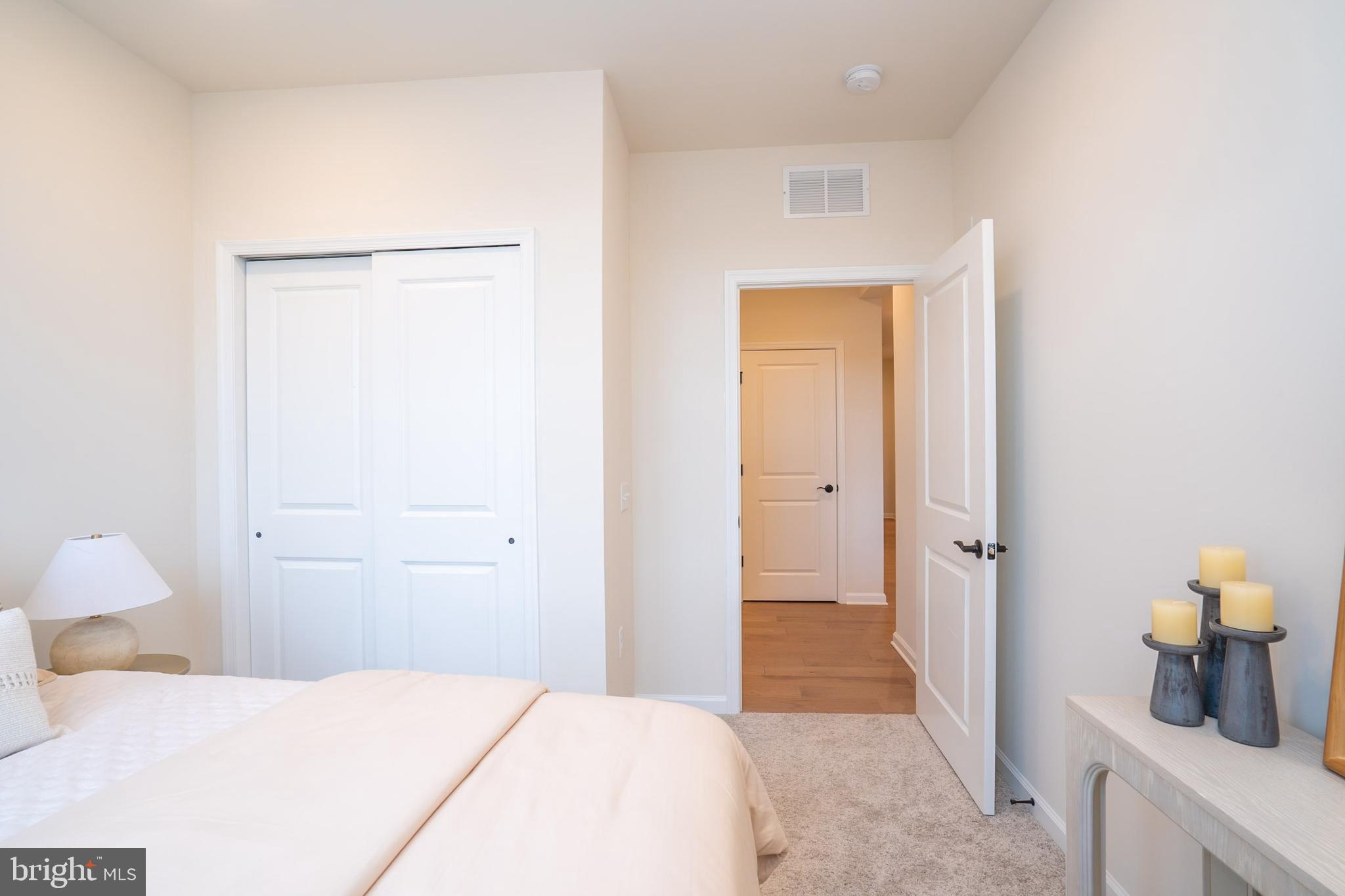 1 Culvert Drive, Unit 312 Princeton Junction, NJ 08540 - Photo 26 of 58 a bedroom with a bed and utility room