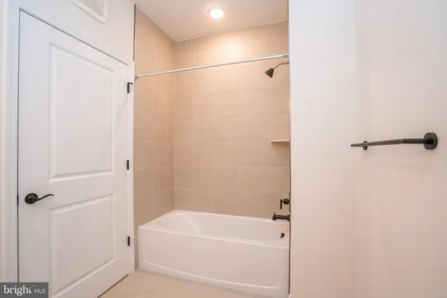 a large white bed in a white room