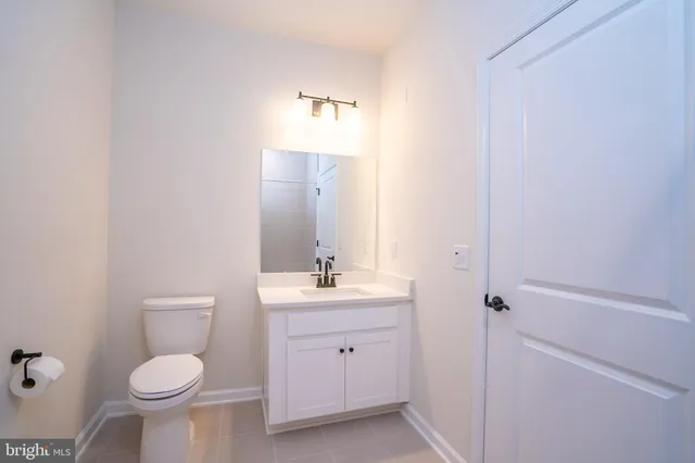 a bathroom with a double vanity sink mirror and shower