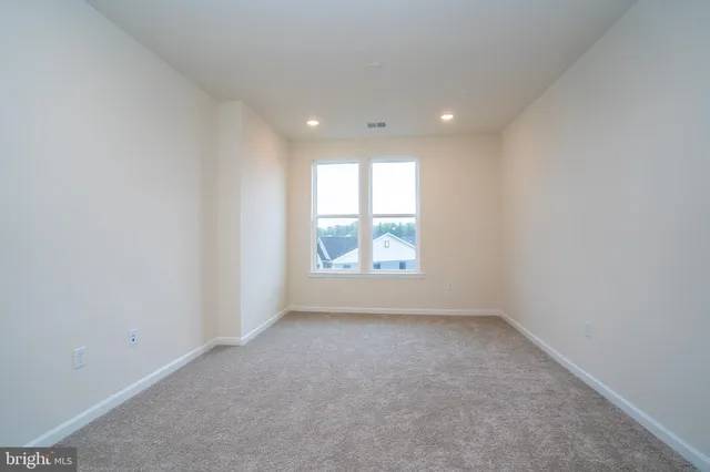 a large bathroom with a double vanity sink and a mirror