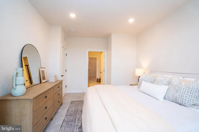 a bathroom with a glass door shower and toilet