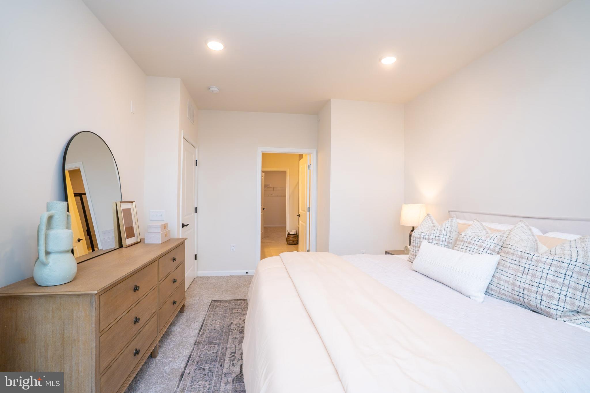 1 Culvert Drive, Unit 312 Princeton Junction, NJ 08540 - Photo 32 of 58 a large white bed in a white room