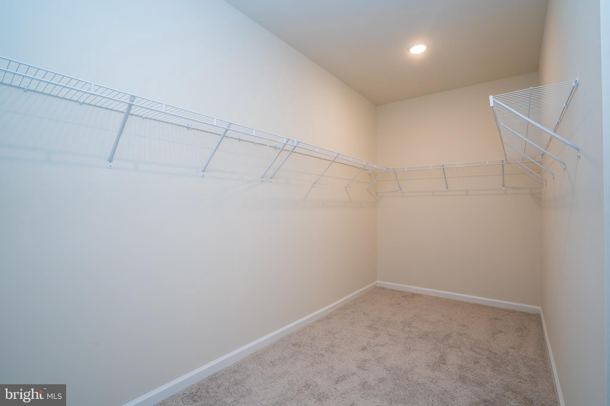 1 Culvert Drive, Unit 312 Princeton Junction, NJ 08540 - Photo 41 of 58 a view of a room with racks on the wall