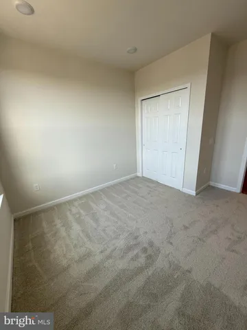 a view of a balcony with two chairs and a deck