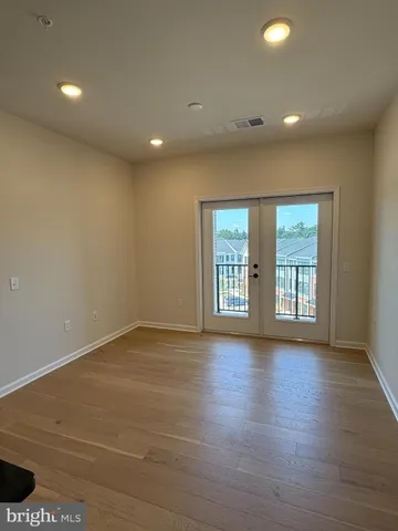 a view of a patio with a table and chairs