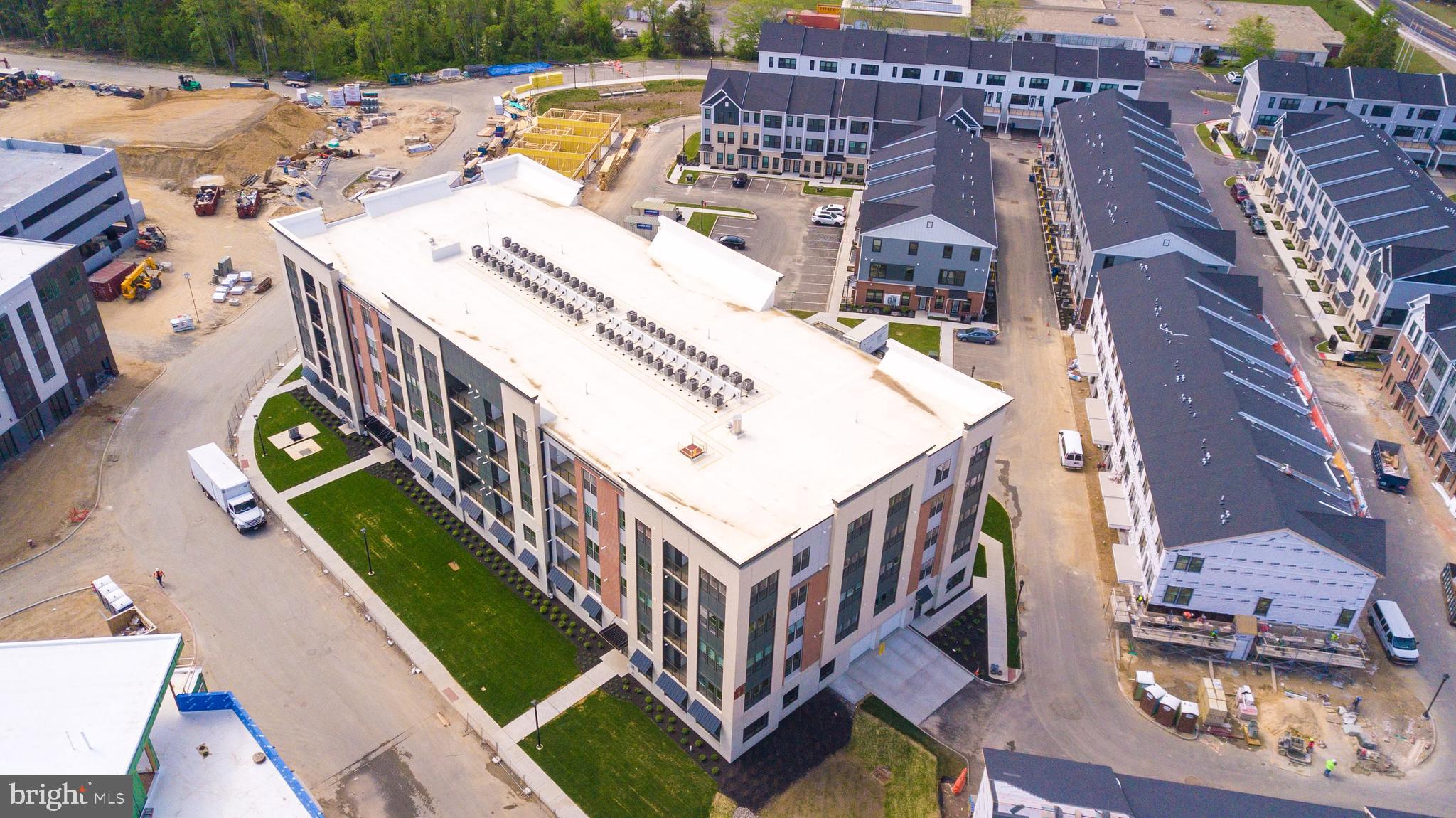 1 Culvert Drive, Unit 312 Princeton Junction, NJ 08540 - Photo 51 of 58 a view of a balcony with two chairs and a deck