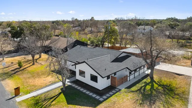 a aerial view of a house with a big yard