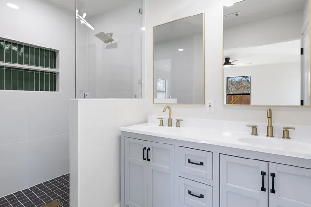 a view of a livingroom with a hardwood floor and a ceiling fan