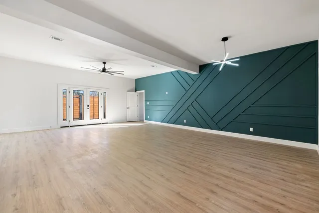 a kitchen with kitchen island a sink and wooden floor