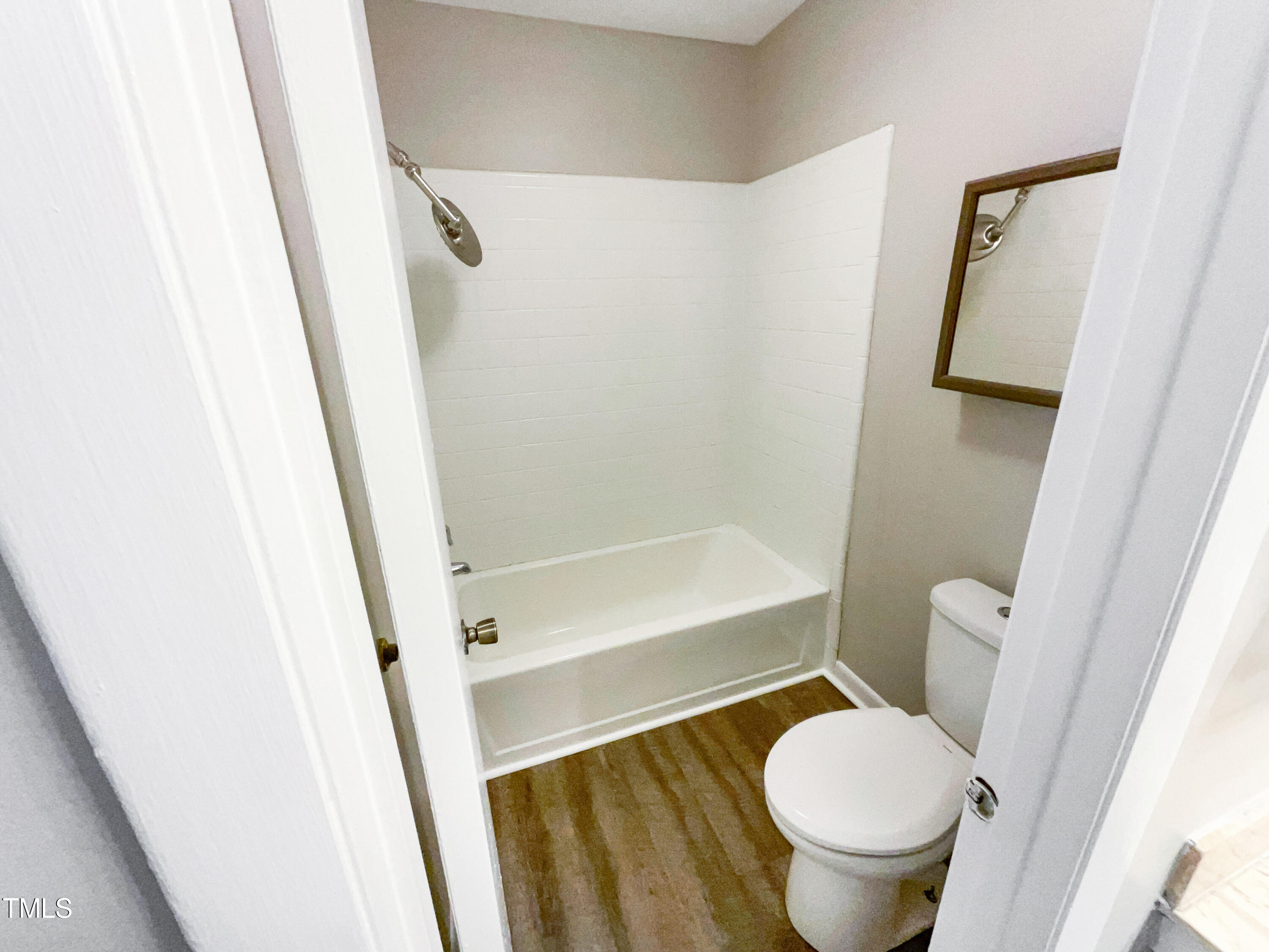 1304 Seaton Road, Unit 7 Durham, NC 27713 - Photo 17 of 18 a bathroom with a toilet and a shower