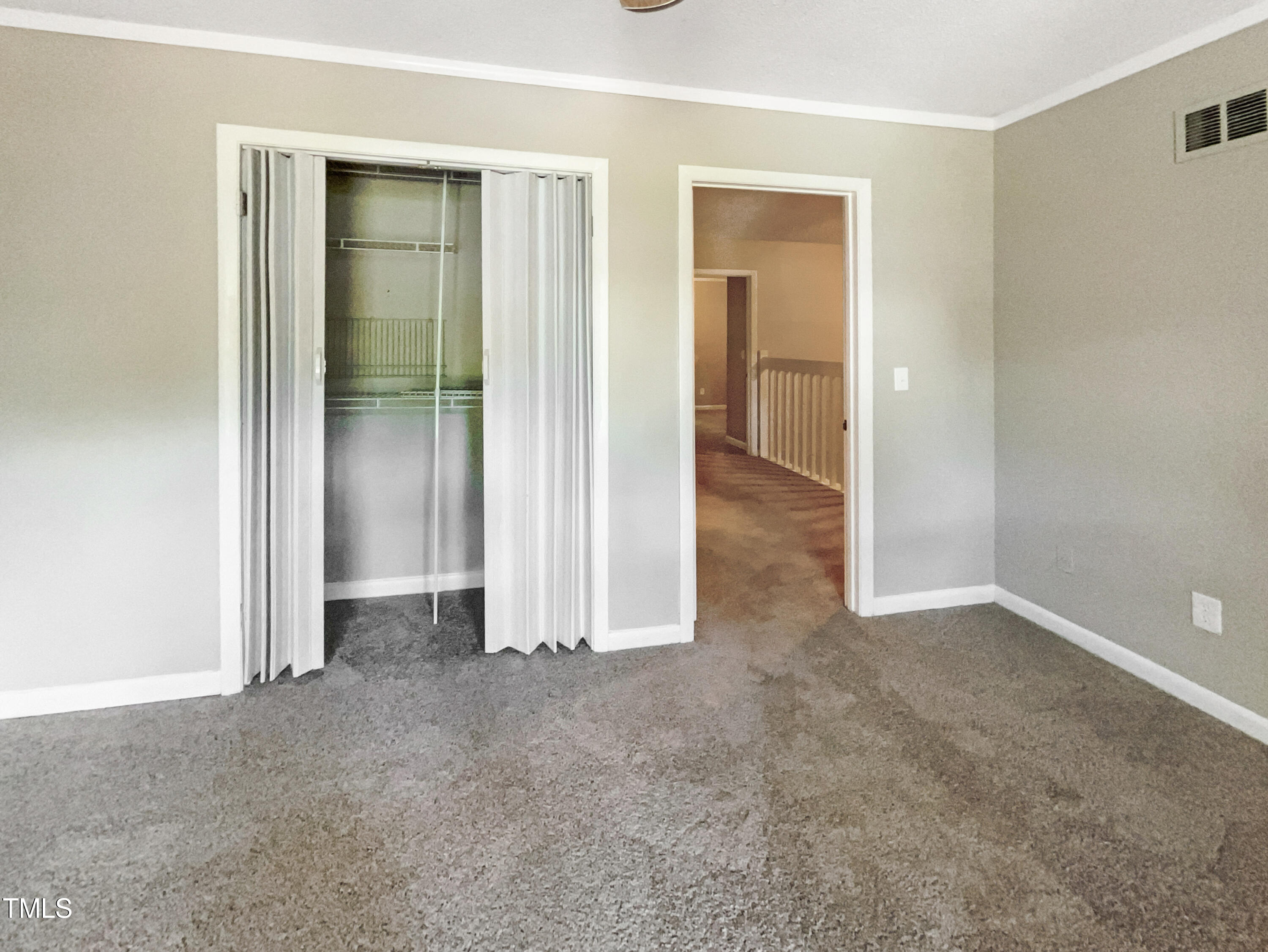 1304 Seaton Road, Unit 7 Durham, NC 27713 - Photo 18 of 18 an empty room with closet and a bathroom