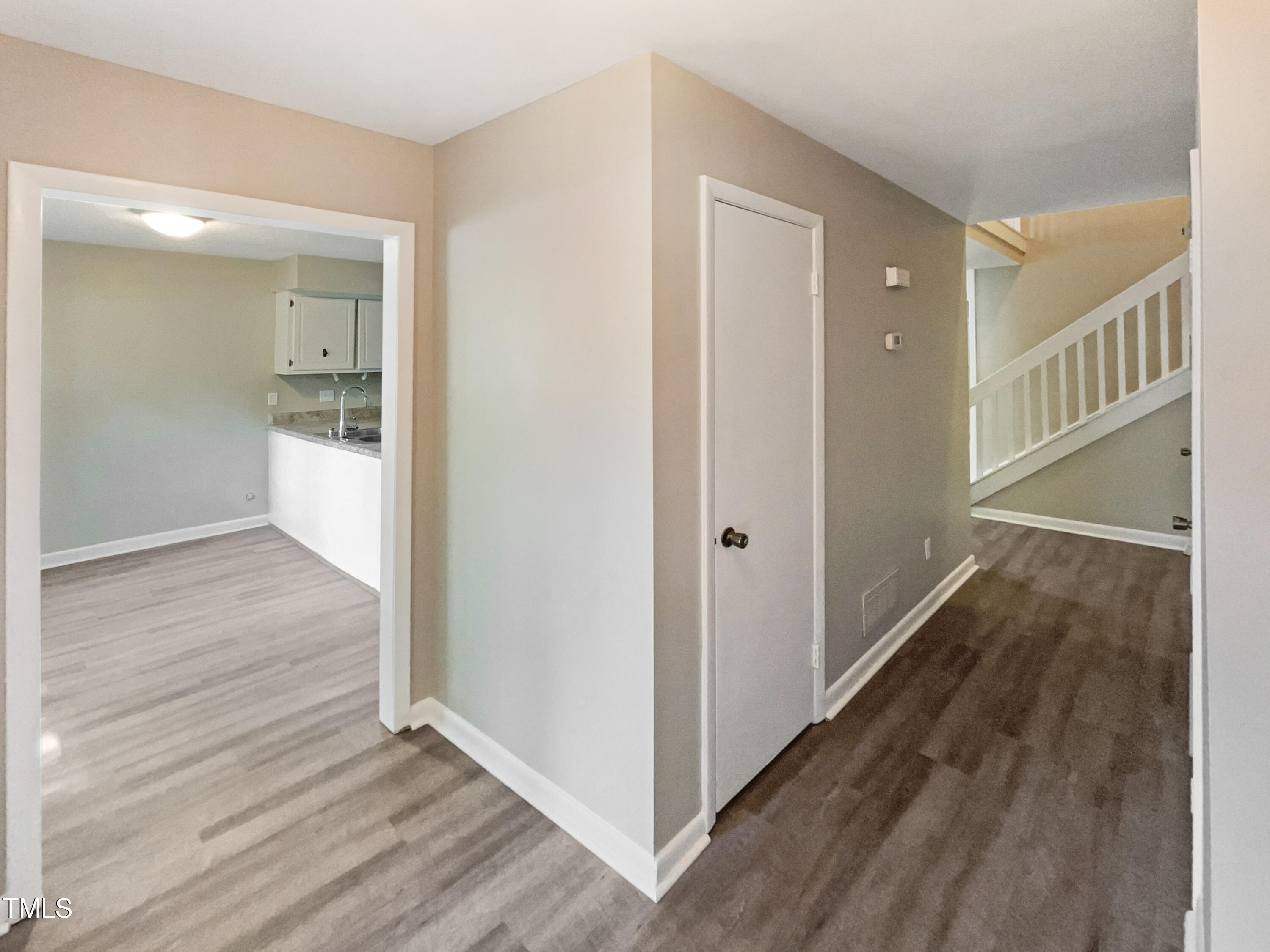 1304 Seaton Road, Unit 7 Durham, NC 27713 - Photo 6 of 18 a view of a hallway with wooden floor and staircase