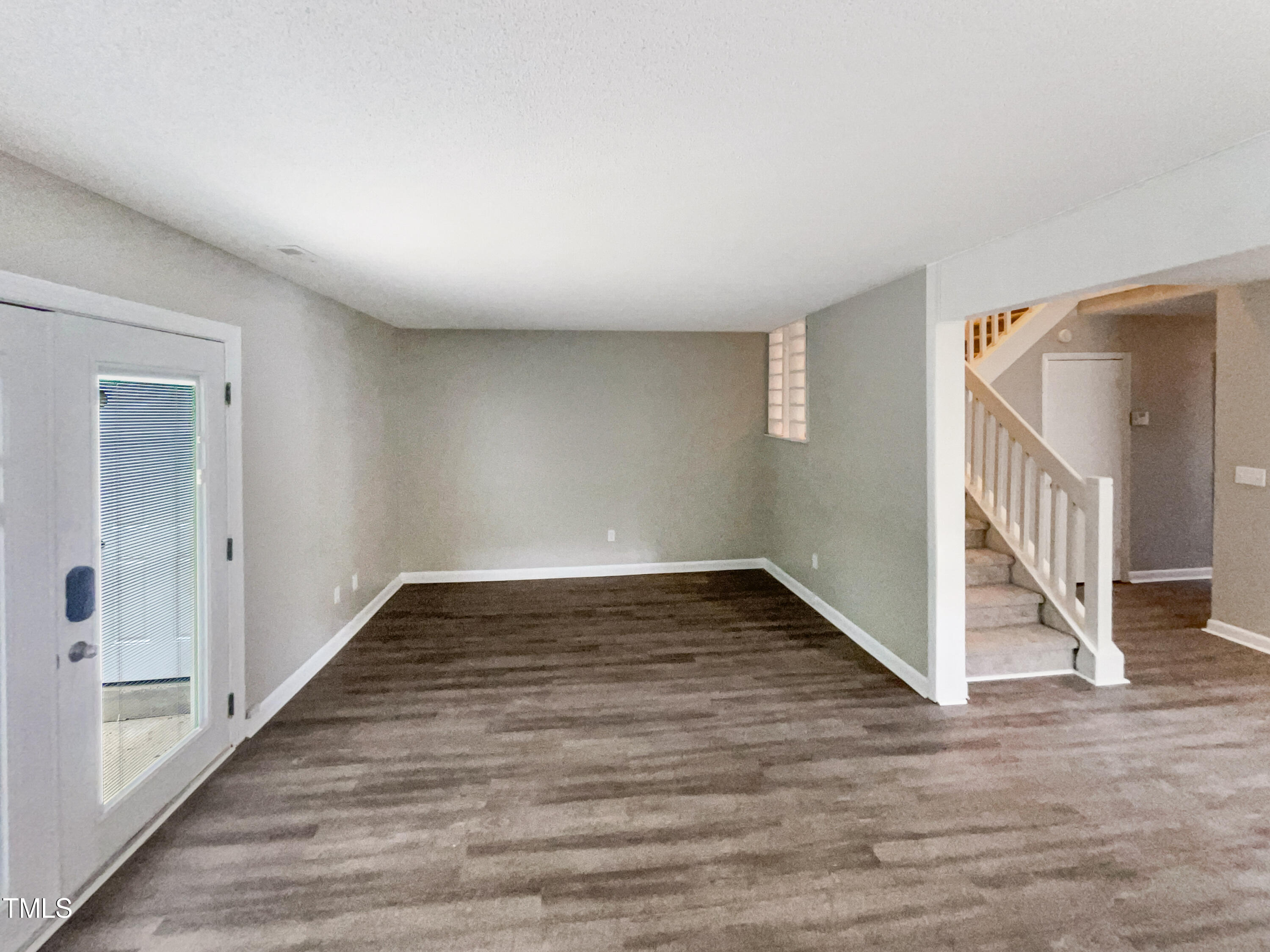1304 Seaton Road, Unit 7 Durham, NC 27713 - Photo 8 of 18 a view of a hallway view with wooden floor and staircase