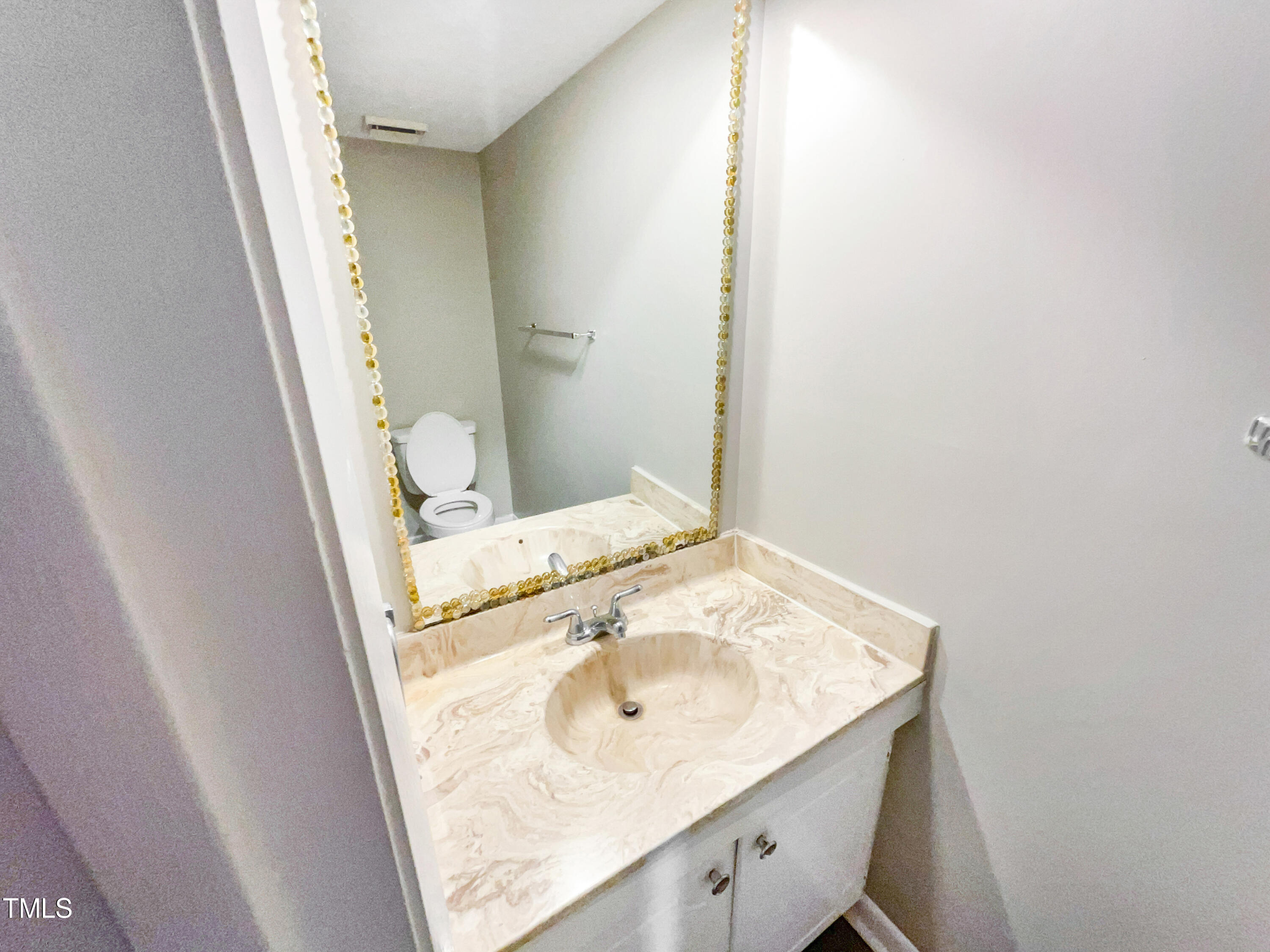 1304 Seaton Road, Unit 7 Durham, NC 27713 - Photo 10 of 18 a bathroom with a sink and a mirror