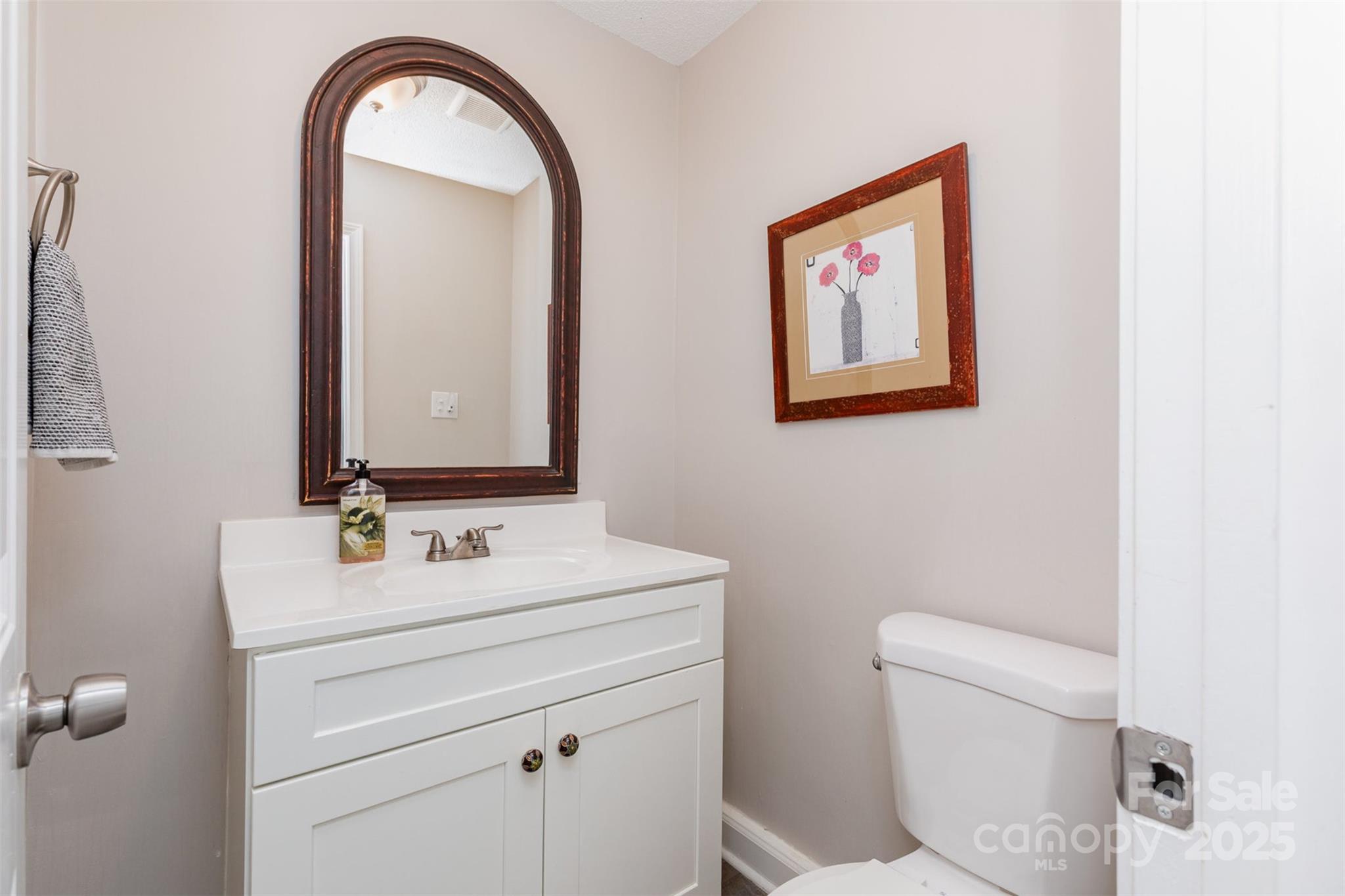1041 Brawley School Road Mooresville, NC 28117 - Photo 11 of 19 a bathroom with a toilet sink and mirror