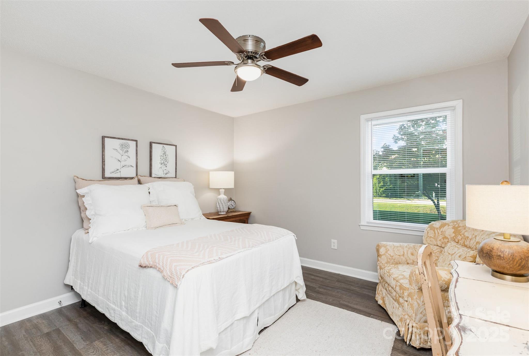 1041 Brawley School Road Mooresville, NC 28117 - Photo 15 of 19 a bedroom with a large bed and a large window