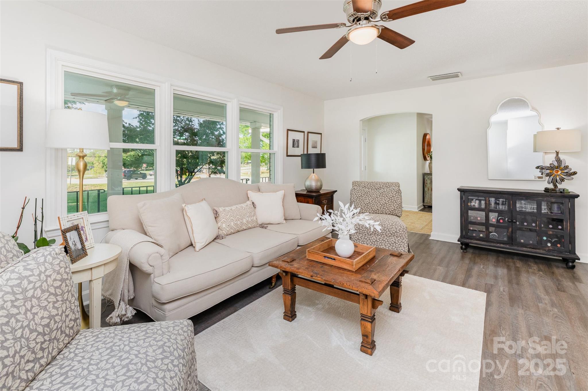 1041 Brawley School Road Mooresville, NC 28117 - Photo 8 of 19 a living room with furniture a rug and a large window