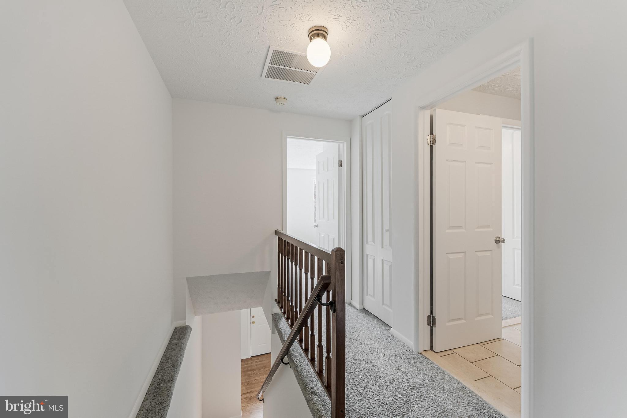 1682 Harvest Green Court Reston, VA 20194 - Photo 15 of 39 a view of a hallway with staircase