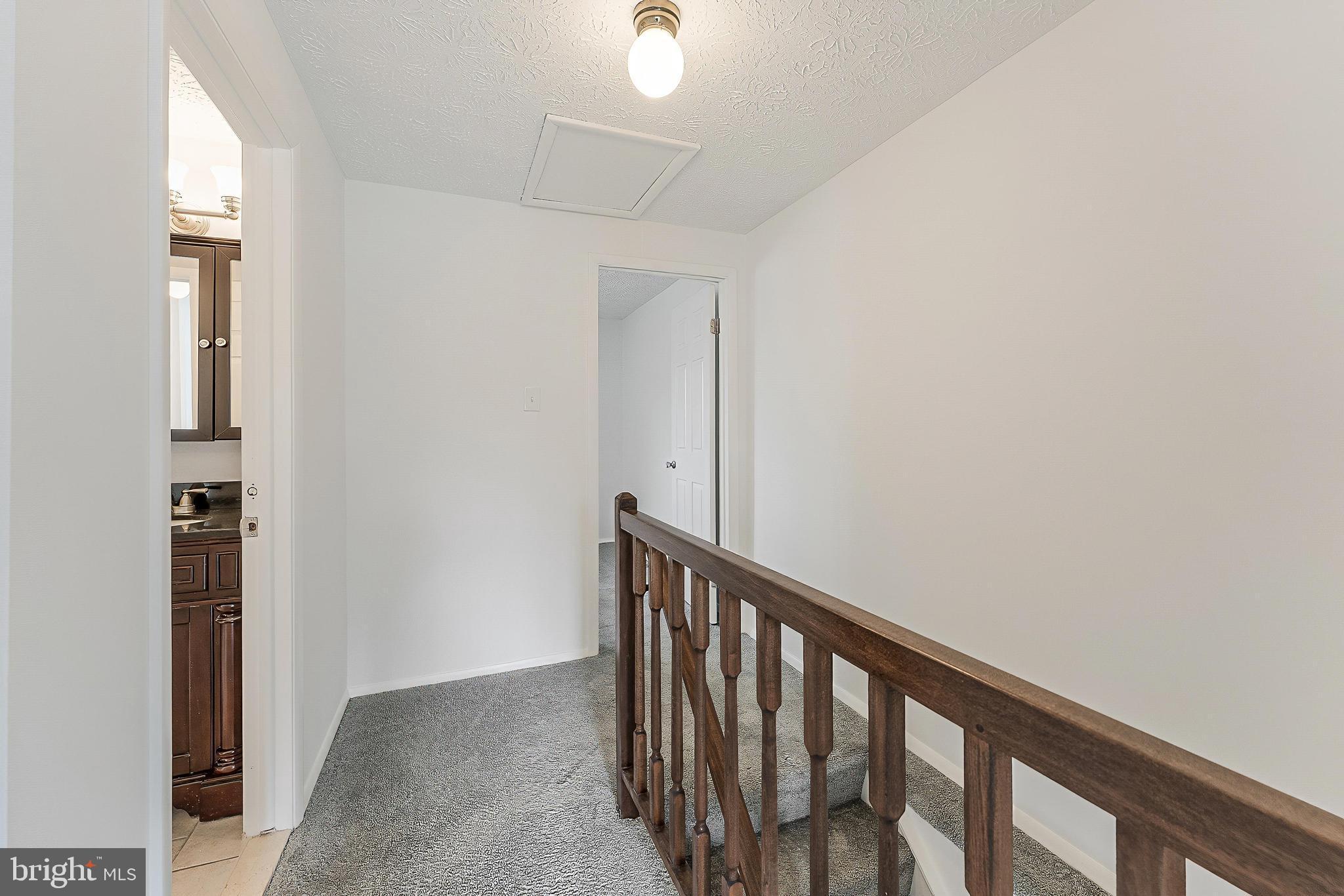 1682 Harvest Green Court Reston, VA 20194 - Photo 16 of 39 a view of a hallway with wooden floor and entryway