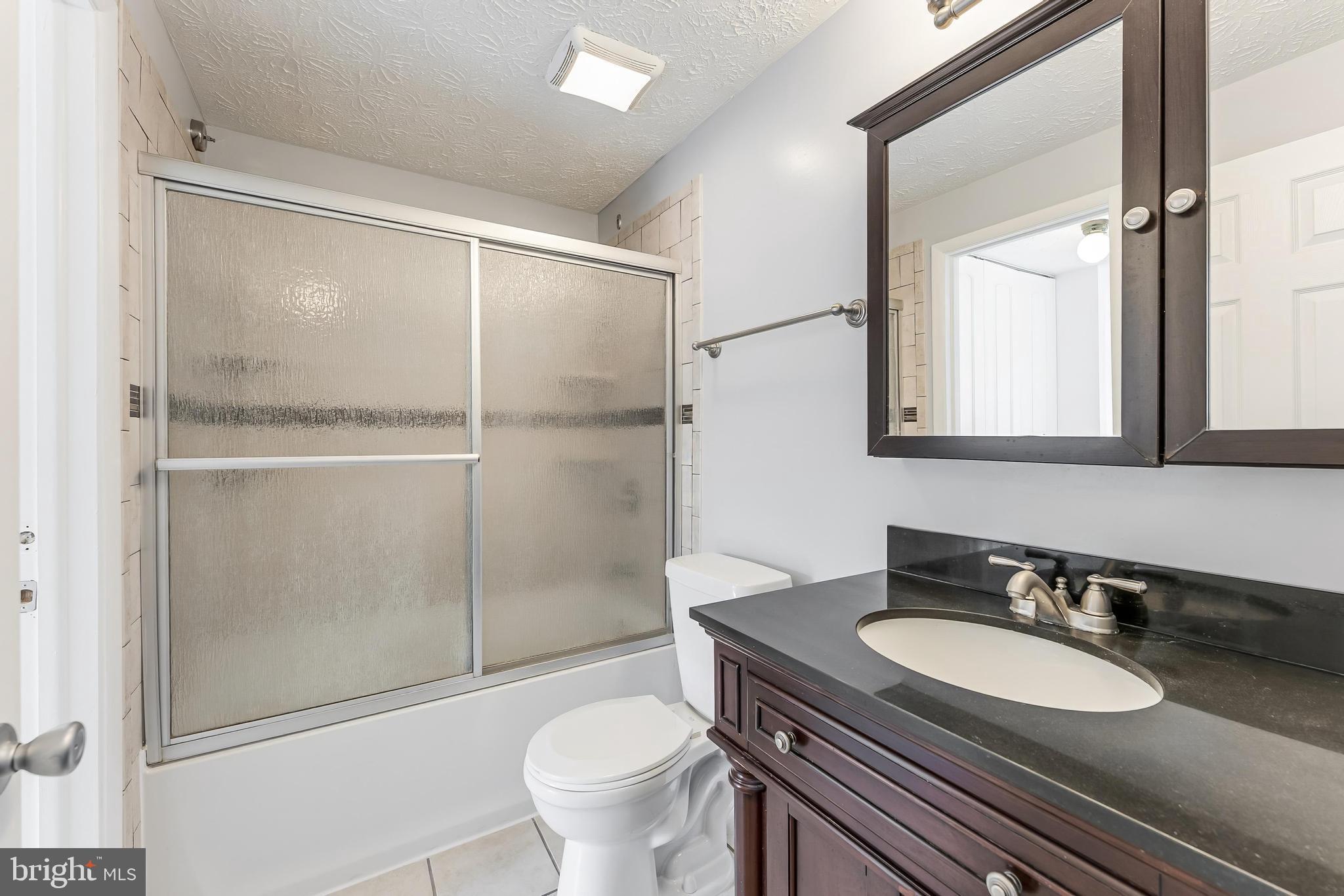 1682 Harvest Green Court Reston, VA 20194 - Photo 17 of 39 a bathroom with a sink toilet and shower