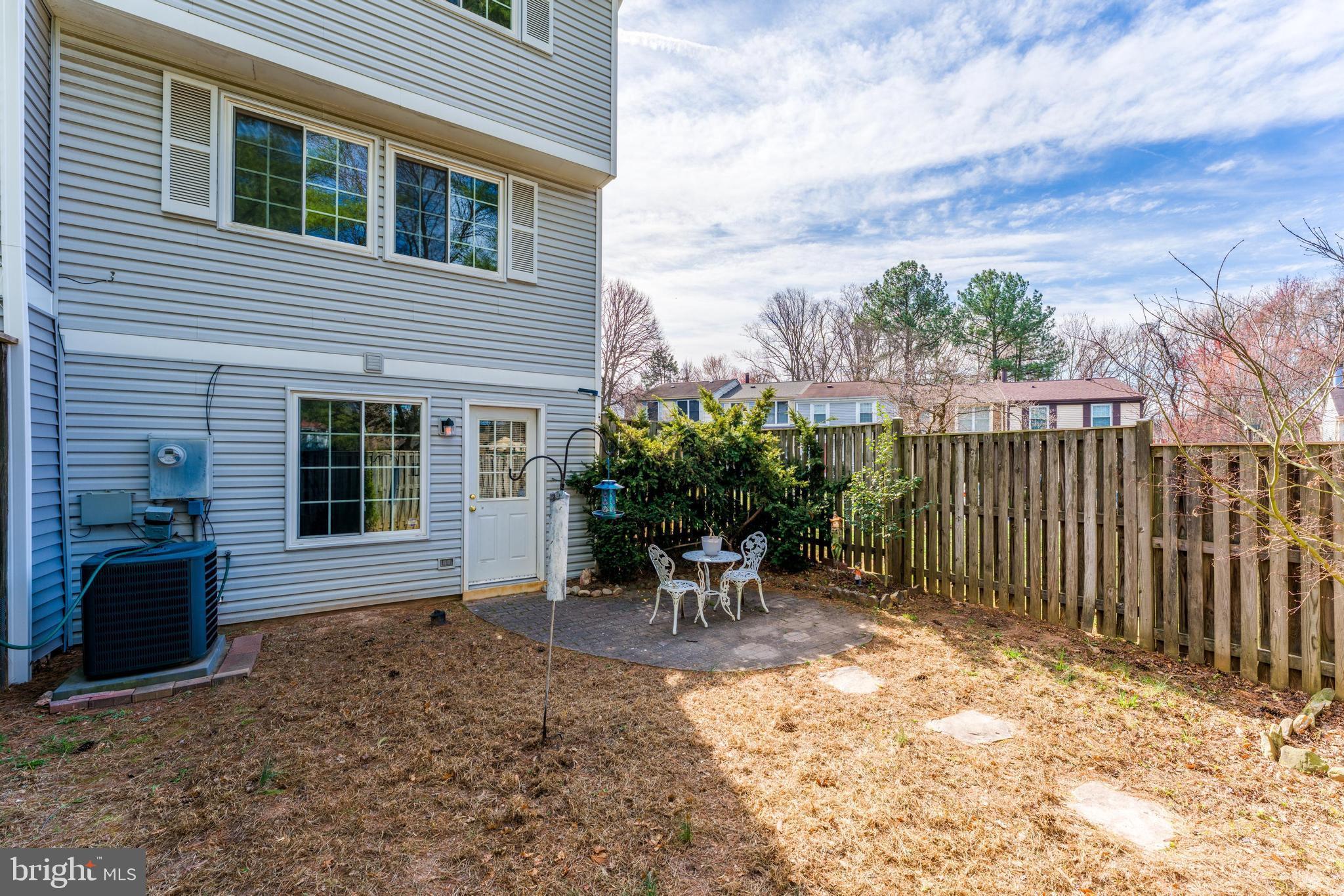 1682 Harvest Green Court Reston, VA 20194 - Photo 38 of 39 a view of a house with backyard and sitting area