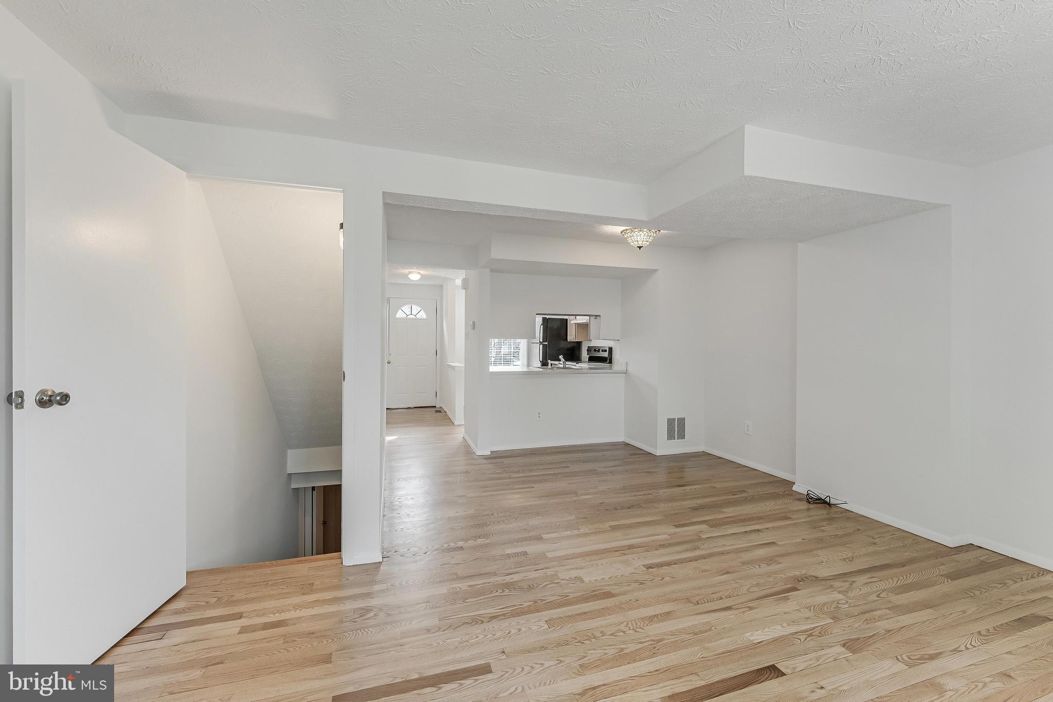 1682 Harvest Green Court Reston, VA 20194 - Photo 6 of 39 a view of empty room with wooden floor