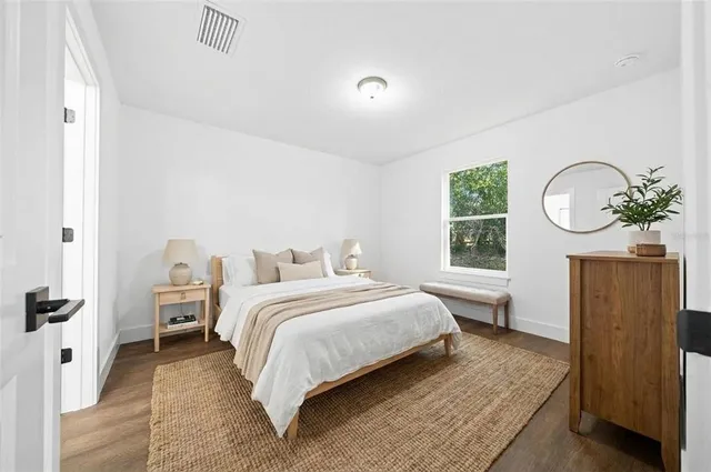 an empty room with wooden floor