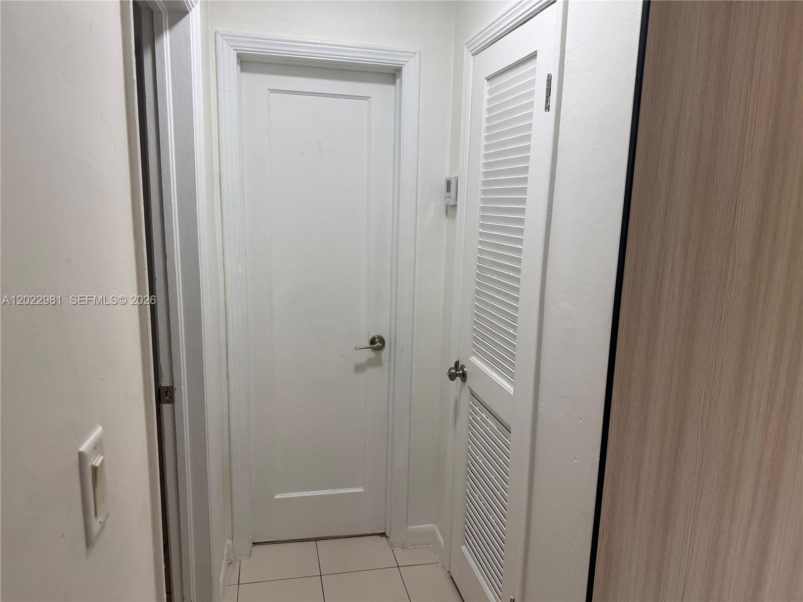 5940 Southwest 2nd Street Miami, FL 33144 - Photo 16 of 22 a bathroom with a shower and a sink