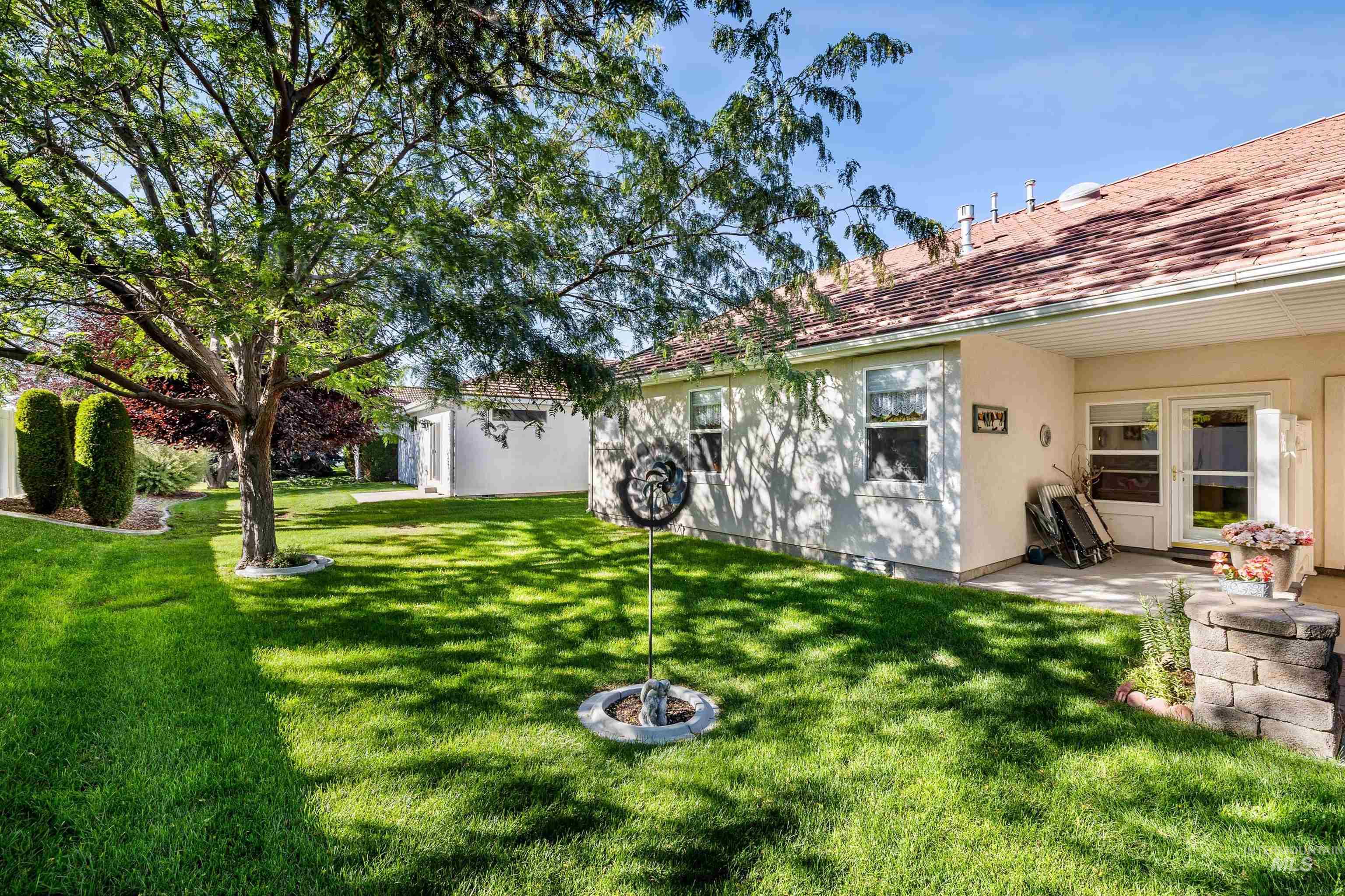 215 Los Lagos Twin Falls, ID 83301 - Photo 23 of 30 View of green lawn featuring a patio